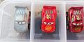 Primer Lightning McQueen displayed w/ stock variants.